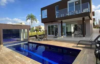 Imagem: A casa em condomínio possui 4 Dormitórios, 5 Banheiros, 4