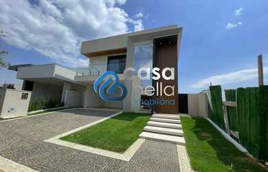 Imagem: A casa possui 4 Dormitórios, 5 Banheiros, 4 Vagas na garagem