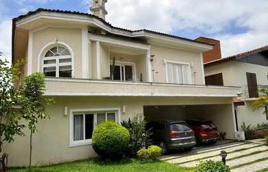 Imagem: A casa possui 4 Dormitórios, 4 Banheiros, 4 Vagas na garagem