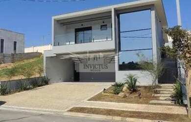 Imagem: A casa possui 3 Dormitórios, 5 Banheiros, 4 Vagas na garagem