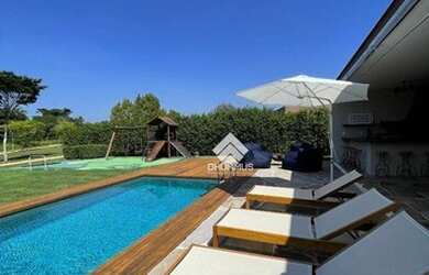 Imagem: A casa em condomínio possui 4 Dormitórios, 5 Banheiros, 5