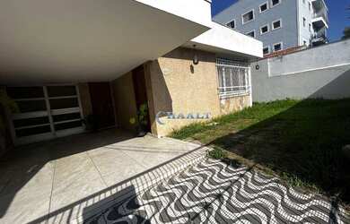 Imagem: A casa possui 3 Dormitórios, 2 Banheiros, 3 Vagas na garagem