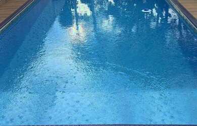 Imagem: A casa possui 2 Dormitórios, 2 Banheiros, 3 Vagas na garagem