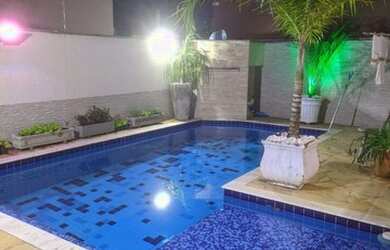 Imagem: A casa possui 4 Dormitórios, 3 Vagas na garagem e está localizado