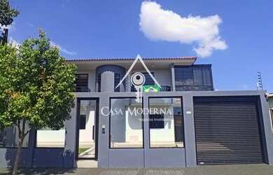 Imagem: A casa possui 3 Dormitórios, 4 Banheiros, 5 Vagas na garagem