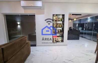 Imagem: A casa possui 2 Dormitórios, 2 Banheiros, 3 Vagas na garagem