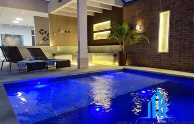 Imagem: A casa possui 4 Dormitórios, 3 Banheiros, 4 Vagas na garagem