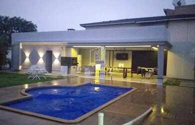 Imagem: A casa possui 3 Dormitórios, 5 Banheiros, 4 Vagas na garagem