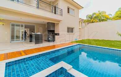 Imagem: A casa em condomínio possui 4 Dormitórios, 5 Banheiros, 2