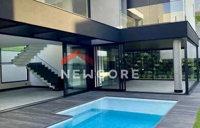 Imagem: A casa em condomínio possui 4 Dormitórios, 5 Banheiros, 5