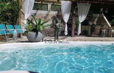 Imagem: A casa possui 3 Dormitórios, 4 Banheiros, 5 Vagas na garagem