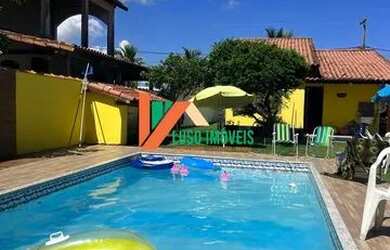 Imagem: A casa possui 3 Dormitórios, 3 Banheiros, 5 Vagas na garagem