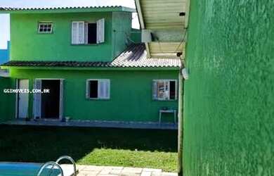 Imagem: A casa possui 3 Dormitórios, 2 Banheiros, 1 Vaga na garagem