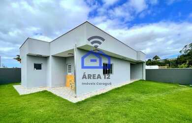 Imagem: A casa possui 3 Dormitórios, 2 Banheiros, 4 Vagas na garagem