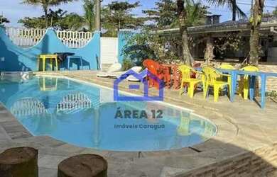 Imagem: A casa possui 3 Dormitórios, 3 Banheiros, 4 Vagas na garagem