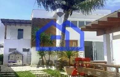 Imagem: A casa possui 4 Dormitórios, 5 Banheiros, 4 Vagas na garagem