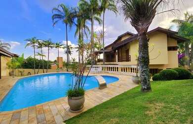 Imagem: A casa em condomínio possui 5 Dormitórios, 5 Banheiros, 5