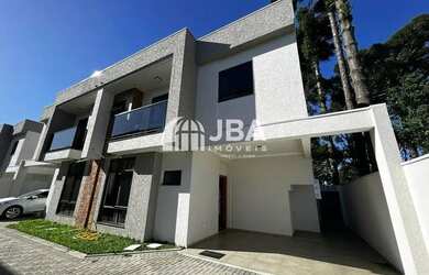 Imagem: A casa possui 3 Dormitórios, 2 Banheiros, 2 Vagas na garagem