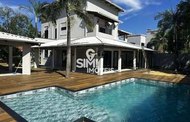 Imagem: A casa possui 4 Dormitórios, 4 Banheiros, 2 Vagas na garagem