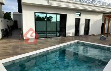 Imagem: A casa possui 4 Dormitórios, 5 Banheiros, 2 Vagas na garagem