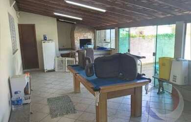 Imagem: A casa possui 4 Dormitórios, 4 Banheiros, 4 Vagas na garagem