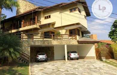 Imagem: A casa em condomínio possui 5 Dormitórios, 5 Banheiros, 5