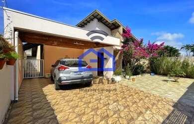 Imagem: A casa possui 3 Dormitórios, 3 Banheiros, 4 Vagas na garagem