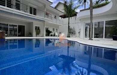 Imagem: A casa em condomínio possui 5 Dormitórios, 5 Banheiros, 5