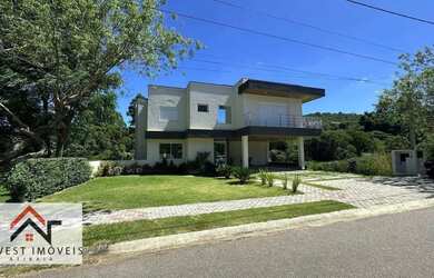 Imagem: A casa em condomínio possui 5 Dormitórios, 5 Banheiros, 5