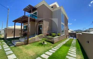 Imagem: A casa possui 4 Dormitórios, 5 Banheiros, 3 Vagas na garagem