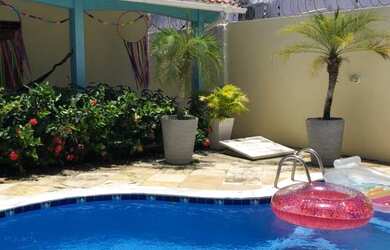 Imagem: A casa possui 3 Dormitórios e 2 Vagas na garagem e está localizado