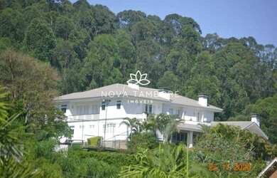 Imagem: A casa possui 5 Dormitórios, 5 Banheiros, 5 Vagas na garagem