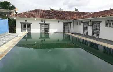 Imagem: A casa possui 5 Dormitórios, 5 Banheiros, 5 Vagas na garagem