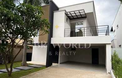 Imagem: A casa possui 4 Dormitórios, 5 Banheiros, 4 Vagas na garagem