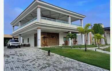 Imagem: A casa possui 5 Dormitórios, 5 Banheiros, 5 Vagas na garagem