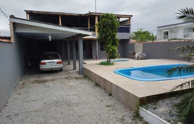 Imagem: A casa possui 5 Dormitórios, 3 Banheiros, 3 Vagas na garagem