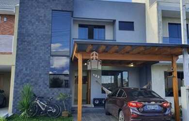 Imagem: A casa possui 4 Dormitórios, 2 Banheiros, 2 Vagas na garagem