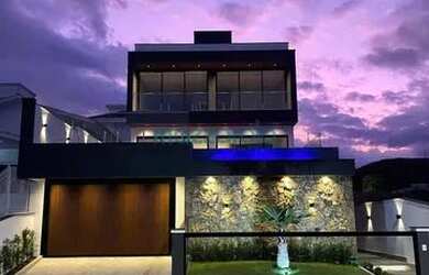 Imagem: A casa possui 3 Dormitórios, 4 Banheiros, 3 Vagas na garagem