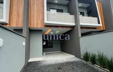 Imagem: A casa possui 3 Dormitórios, 2 Banheiros, 2 Vagas na garagem