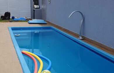 Imagem: A casa possui 4 Dormitórios, 3 Banheiros, 4 Vagas na garagem