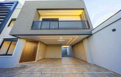 Imagem: A casa possui 4 Dormitórios, 5 Banheiros, 3 Vagas na garagem