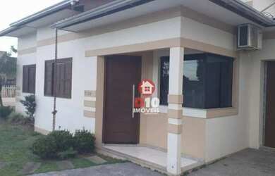 Imagem: A casa possui 3 Dormitórios, 2 Banheiros, 1 Vaga na garagem