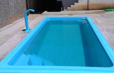 Imagem: A casa possui 3 Dormitórios e Acomodam 14 pessoas e está localizado