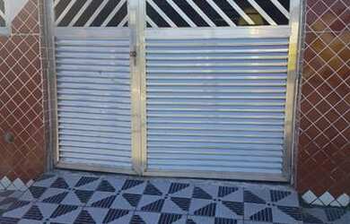 Imagem: A casa possui 2 Dormitórios e 1 Vaga na garagem e está localizado