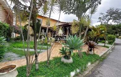 Imagem: A casa possui 3 Dormitórios, 5 Banheiros, 5 Vagas na garagem