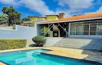 Imagem: A casa possui 4 Dormitórios, 5 Banheiros, 4 Vagas na garagem