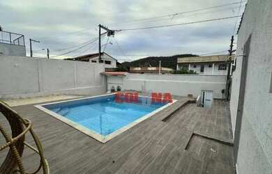 Imagem: A casa possui 4 Dormitórios, 2 Banheiros, 4 Vagas na garagem