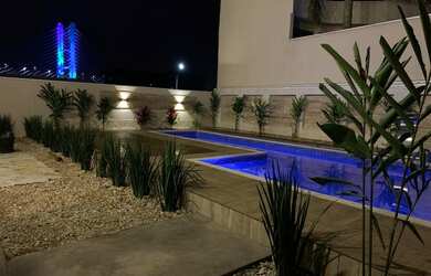 Imagem: A casa possui 3 Dormitórios, 5 Banheiros, 4 Vagas na garagem