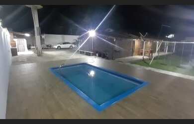 Imagem: A casa possui 3 Dormitórios, 5 Vagas na garagem e está localizado