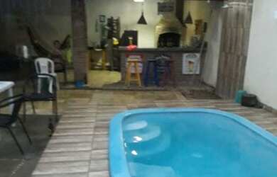 Imagem: A casa possui 3 Dormitórios, 3 Banheiros, 3 Vagas na garagem